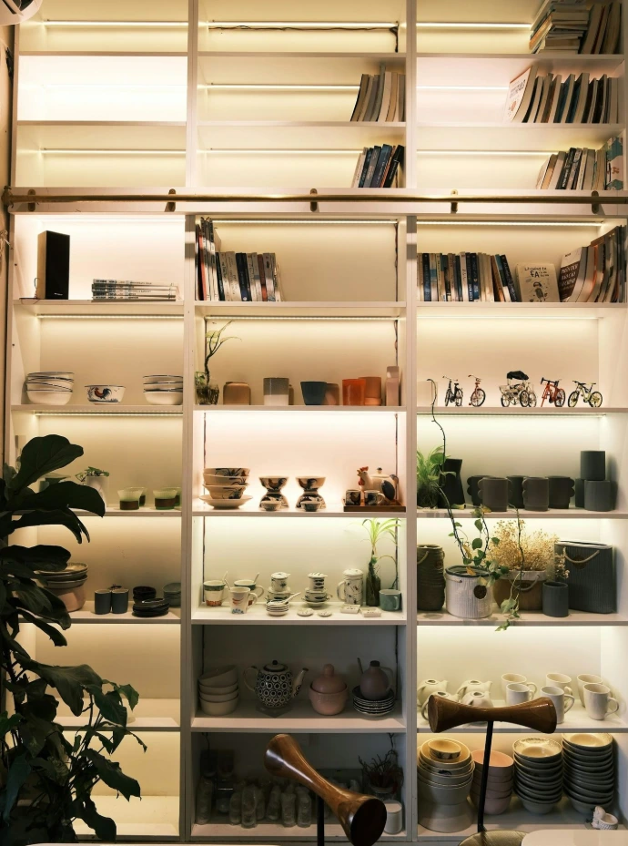 Shelves filled with books and decorative items.